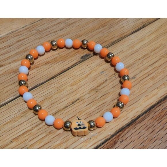 Handmade Orange and White Halloween Stretch Bracelet with Pumpkin - Picture 2 of 11